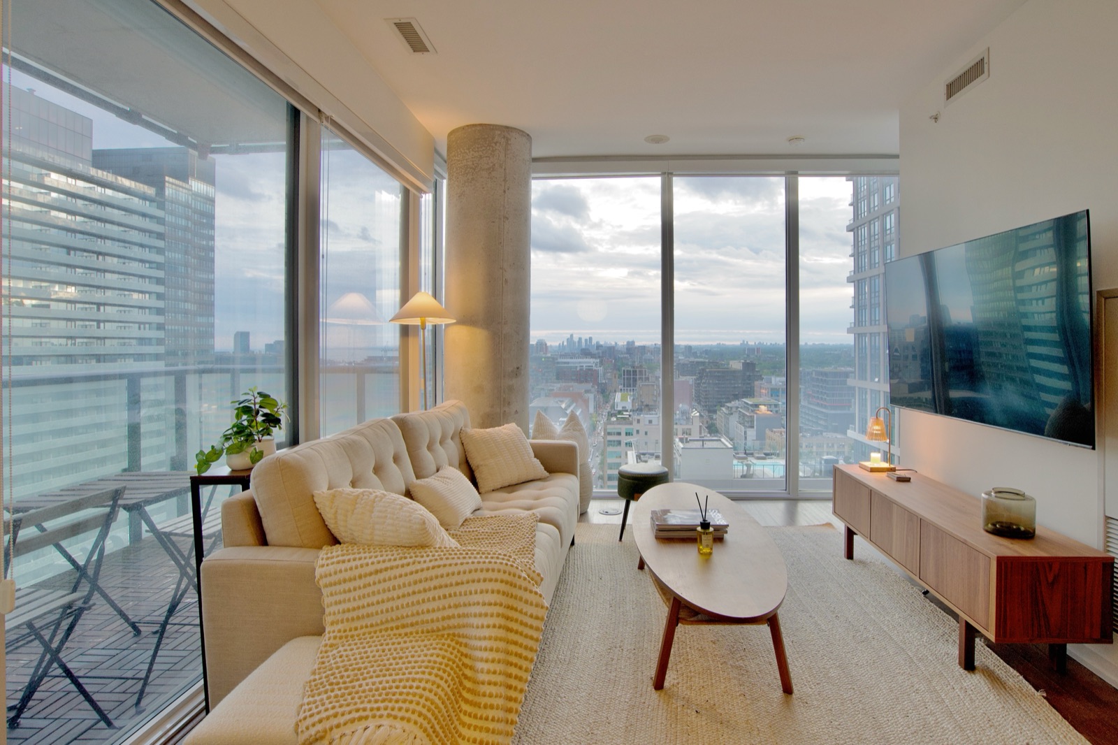 Queen West living room with floor-to-ceiling city views