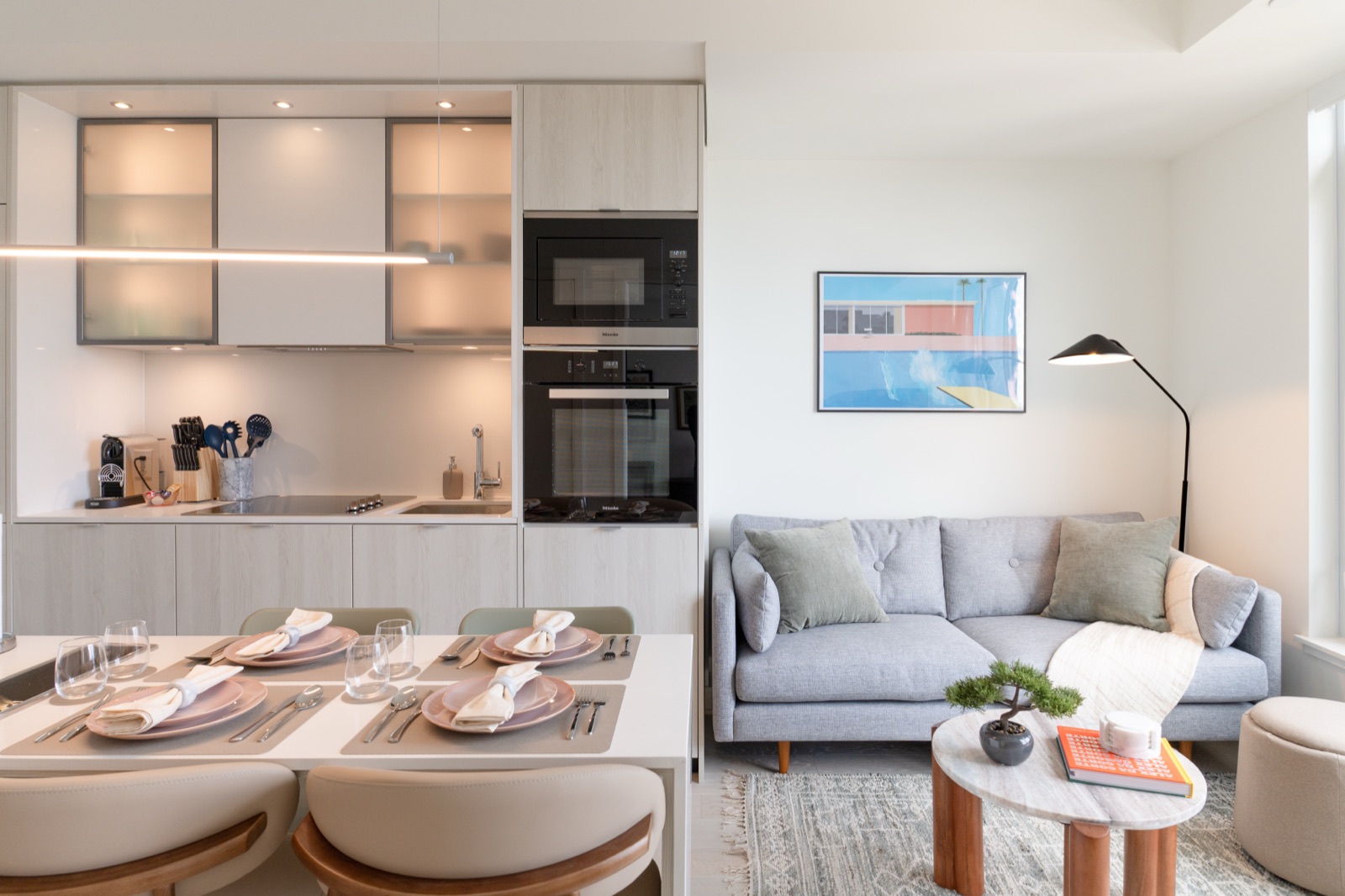 A Loquin-managed Yorkville suite — kitchen, dining and living space